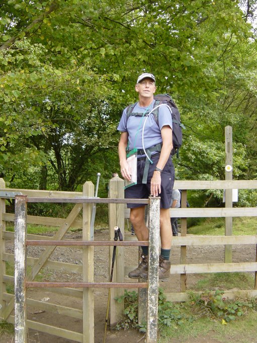 Ian struggles over a stile